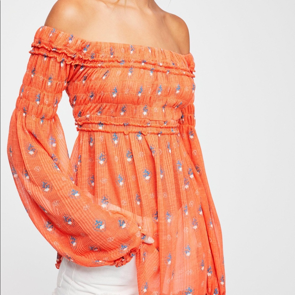 Looking for this top in white and orange!
